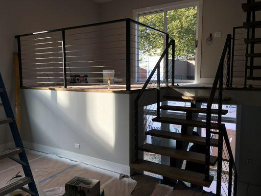 Interior stairs and railings with stainless steel cables