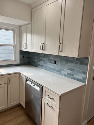 Wellfleet tile In Cerulean.  MSI quartz countertop. Handles are "Westerly"