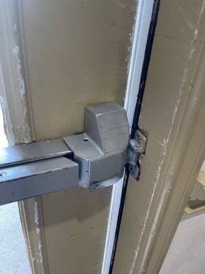 Damaged door locks on side entrances.