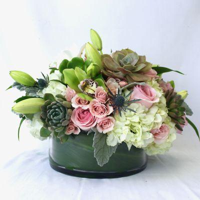 Arrangement with roses, hydrangeas, lillies and succulents