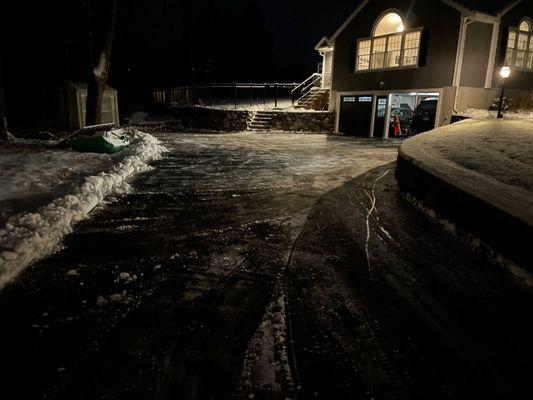 A completely snowblowed/shoveled driveway.