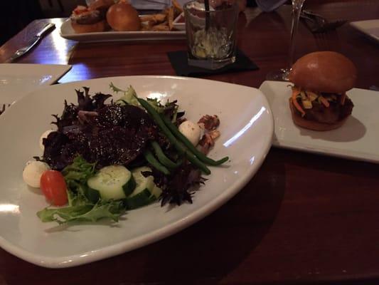 Roasted beet salad and a pork belly slider. Lamb or beef sliders in the distance.