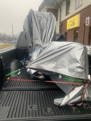 Strapping down a large Elliptical on one of our customers personal vehicles.