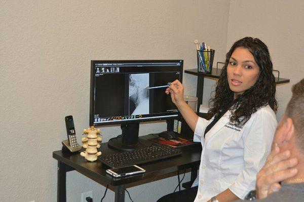 Dr. Gonzalez giving xrays report to a patient