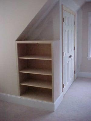 This was an empty bonus room.  We built & installed a cabinet on the end of a new closet we constructed.