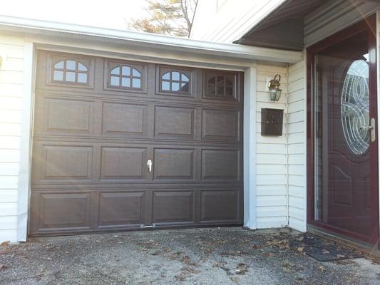 Brown, vinyl door installation. Also, brand new white frame capping, for a clean beautiful finished look.