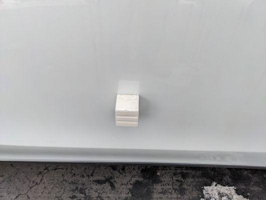 Foam block glued to passenger door.