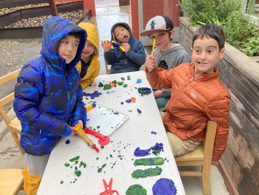 Campers get silly during art project with clay.