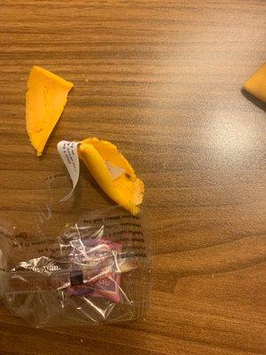 Received open fortune cookie, with black bug poop on the inside