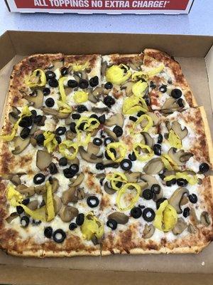 Thin crust with mushrooms, banana peppers, and black olives.