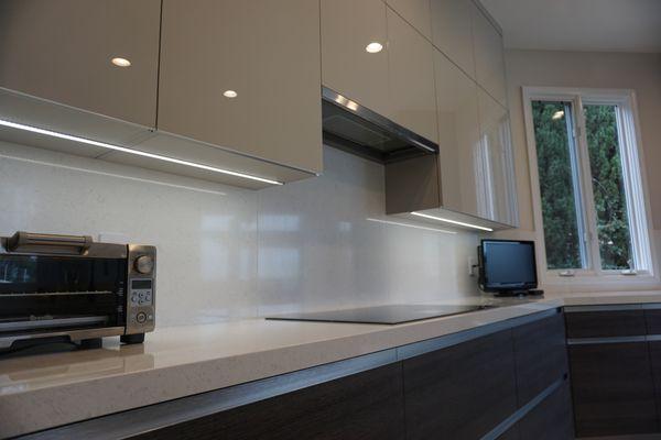 flush mounted under-cabinet lighting and integrated channel handles