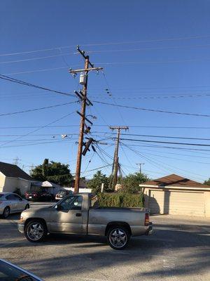 Electric pole by parking area looks completely safe...