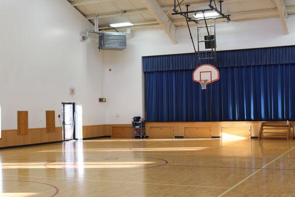 Our gym.  Students have PE daily and we have many cultural and musical events for students and families.