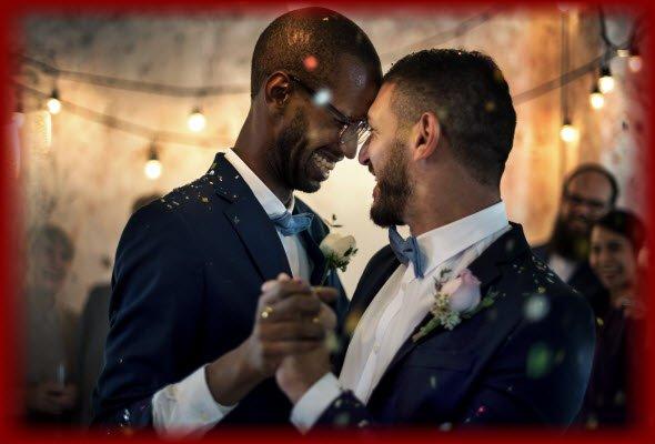 Newlywed gay couple having a wonderful time dancing their "First Dance" at their wedding reception