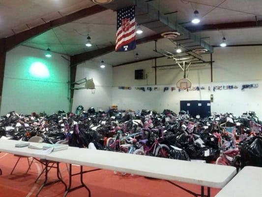 Christmas bikes and gifts volunteers sorted for families who could use a little holiday cheer