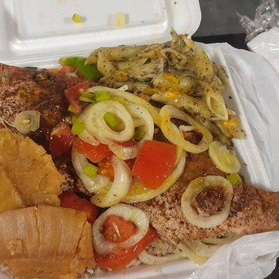 Rice and peas , Snapper fish,  jerk pasta,  Onions, Tomatoes, scallions, and breadfruit.