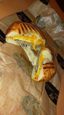 Cheesy sausage egg and cheese bagel panini