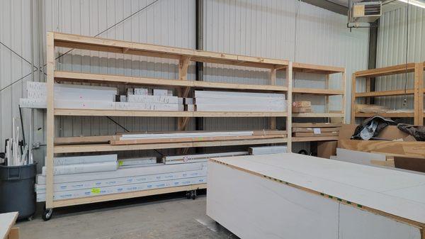 2 8ft x 24in Custom built front loading shelves and 1 8x24in shelf on rolling castor wheels.