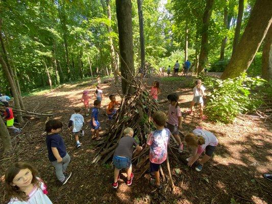 Learning to build outdoor shelters