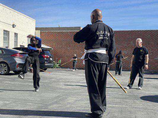 Sifu will take class outdoors at times to enjoy the . Learning weapons outdoors.