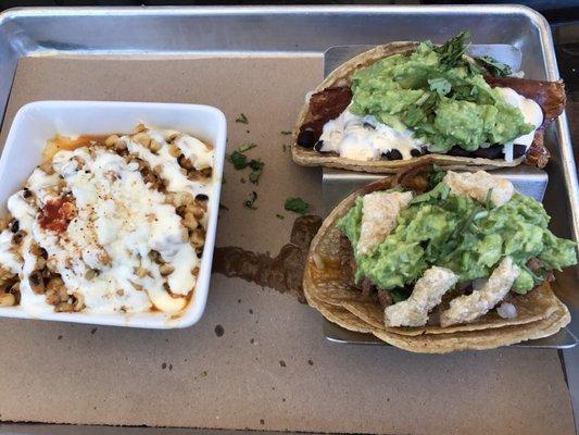 Taco flight with Azteca (steak) taco and Carnitas taco with a side of Baja street corn