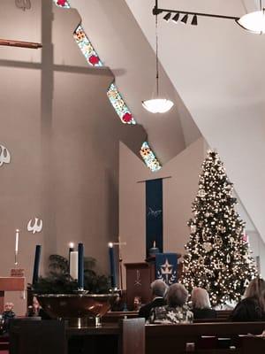 Christmas tree next to the pulpit.