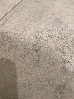 Blue stain on bathroom title floor that won't come out