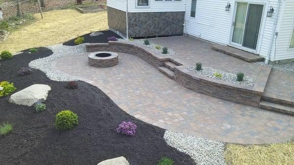 Removed a multi level deck in the back yard and designed this beautiful outdoor living area.