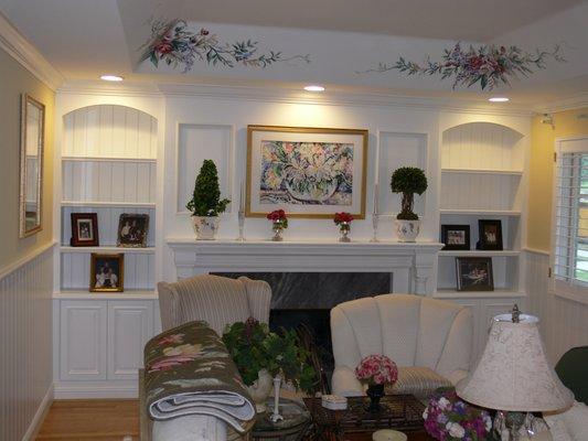 Painted bookcases, mantle, and wall system.