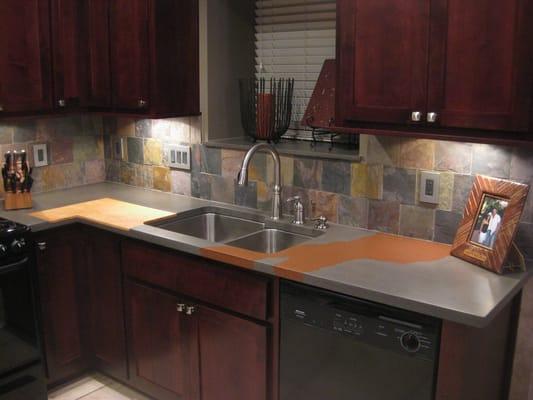 Custom concrete countertop with recessed cutting board