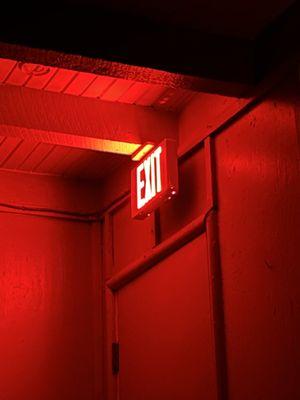 The bright red glowing exit sign over the door INSIDE the room that kept us awake.