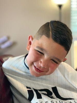 My son never leaves Huttz Cutz without a smile! It's apparent Erika loves what she does