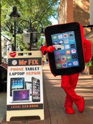 The guy who shares flyers is posing next to Mr Fix iPhone repair sign =)