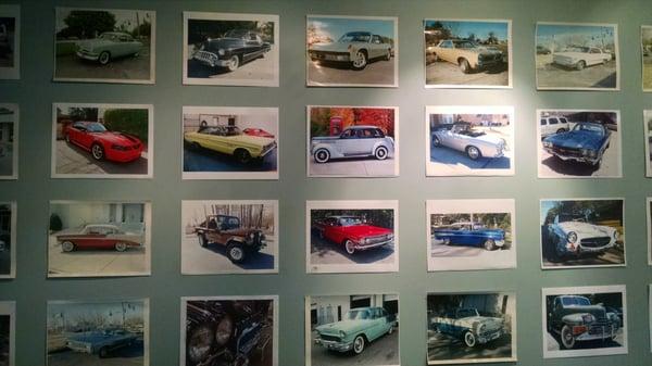 Photos of classic restorations line the wall.