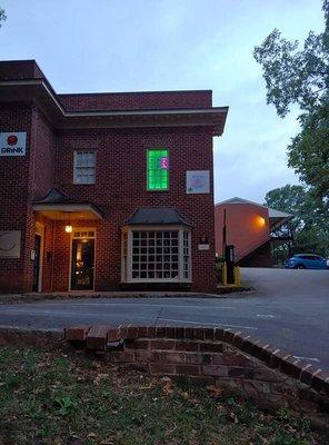 Driving by 215 Glenwood Ave suite D Raleigh NC at night , keep an eye open for that Green light . Means were open.