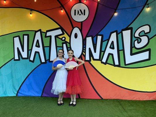 two best friends taking a photo in front of the nationals sign. i am so grateful to have a friend like her