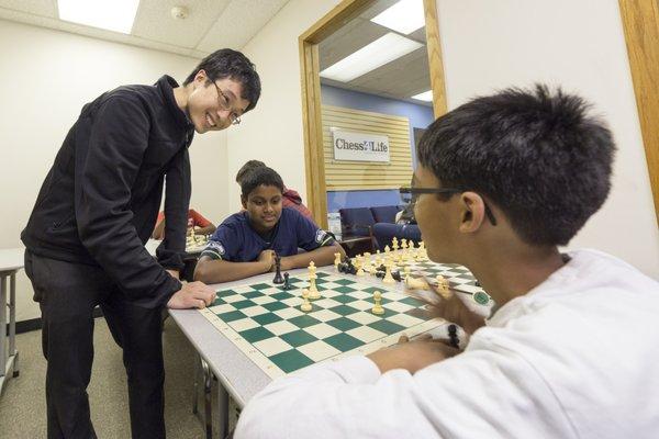 Coach Sloan teaching chess lessons.