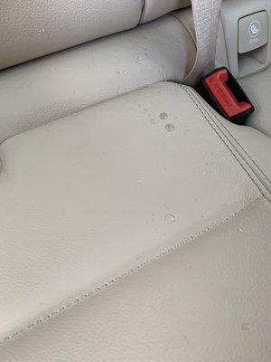 Dirty water on the back seats left by the cleaning guys at the end of the wash