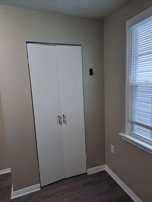 Refreshing a bedroom with new wall and trim paint