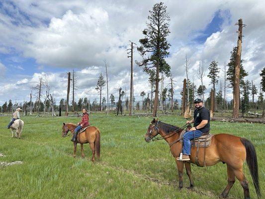 Nice couple enjoying a cool horseback ride in the white mountains.