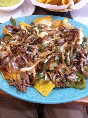 You will not regret getting the steak fajita nachos. I got them without the tomatoes though.