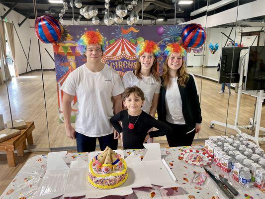 Birthday boy with teachers and staff at a party on FDS premises. Personalized to circus theme, and included instructed time at dance & gym.