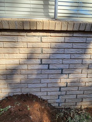 Repaired using concrete piers, mortar touch-up.