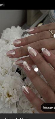 The picture I showed as my inspiration. I wanted fine rounded French tips with chrome on top.