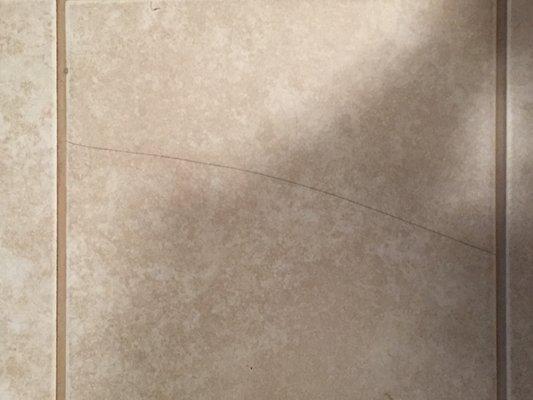 Cracked tile after carpet install