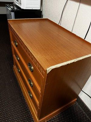 Furniture used to be a tall armoire I guess - was hacked down into a dresser and left like this.