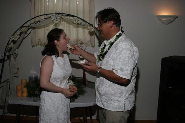 Groom giving Cake to Bride