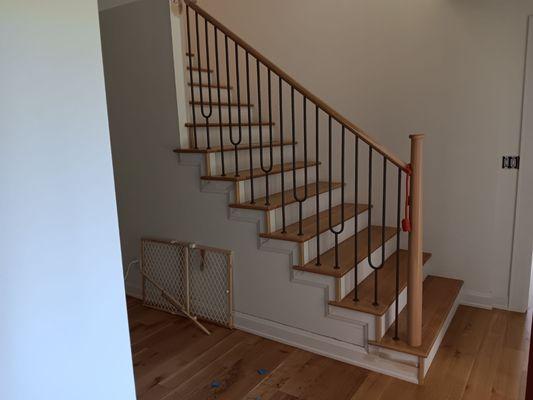 Install of White Oak Treads with returns and painted risers. Floor is 5" wide Rift & Quartered White Oak