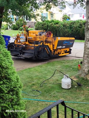 Paving machine getting ready to lay down asphalt.