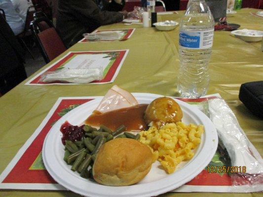 My meal: Thinly sliced turkey with gravy and a hint of cranberry sauce, yeast roll, string beans, mashed potatoes, and macaroni.